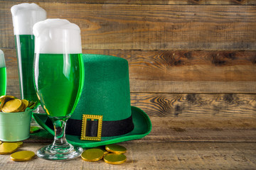 Traditional irish alcohol for St Patrick's day party. Different glasses with green beer, with...