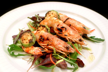 Italian food recipes, grilled shrimp skewer and fresh salad