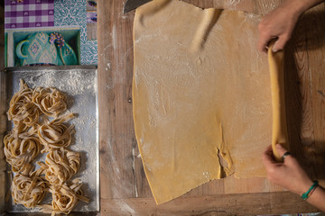 Making fresh Tagliatelle and Quadrucci Pasta on a sunday morning in an Italian Home