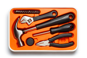 Orange open toolbox with new tools, isolated on white background