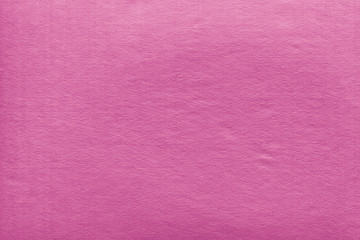 Cardboard pink abstract pattern texture close-up. Retro old paper background. Grunge concrete wall. Vintage blank wallpaper.