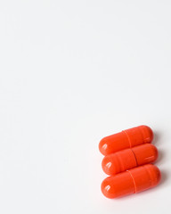 medical capsules antibiotics orange on a white background, The capsule with medication on a white background.