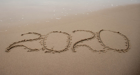  inscription 2020 on a sandy beach