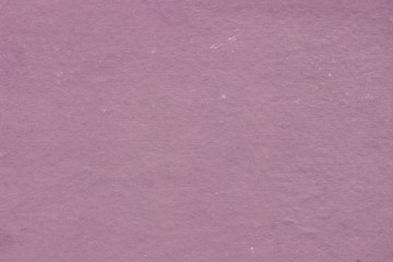 Cardboard pink abstract pattern texture close-up. Retro old paper background. Grunge concrete wall. Vintage blank wallpaper.