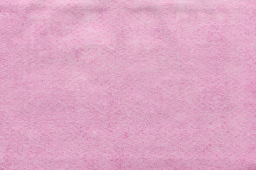 Fototapeta premium Cardboard pink abstract pattern texture close-up. Retro old paper background. Grunge concrete wall. Vintage blank wallpaper.
