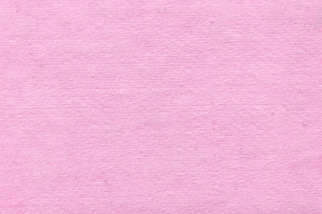 Fototapeta premium Cardboard pink abstract pattern texture close-up. Retro old paper background. Grunge concrete wall. Vintage blank wallpaper.