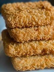  breaded fish on a white background