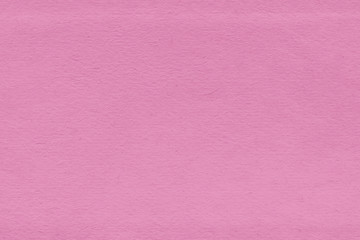 Fototapeta premium Cardboard pink abstract pattern texture close-up. Retro old paper background. Grunge concrete wall. Vintage blank wallpaper.