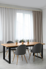 Modern room interior with chairs and table