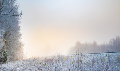 A beautiful winter scenery in the European countryside. First snow landscape. Bright morning.