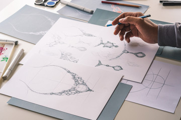 Designer design diamond jewelry drawing sketches making works craft unique handmade luxury necklaces product ideas.