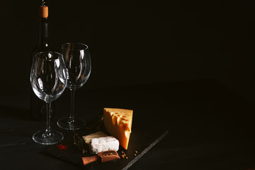 Served table for two. two glasses for wine, cheese appetizers. concept of a romantic dinner for two