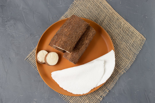 Tapioca, a traditional brazilian snack made from cassava flour. Cassava and dry coconut on the back. 