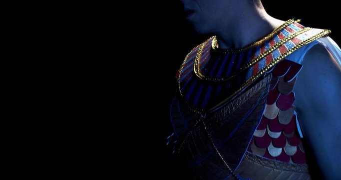 Pharaoh wearing traditional ancient egyptian clothes is turning around, 4k