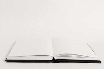 An open book on a table.