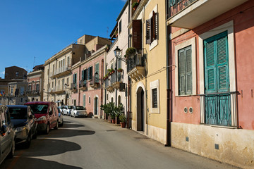 one of the picturesque street in Ortigia, oldest part of the beautiful baroque city of Syracuse in Sicily, Italy