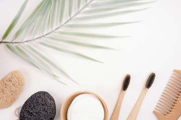Various natural bath tools, eco products, palm leaf decor, white background. Spa, healthcare,...