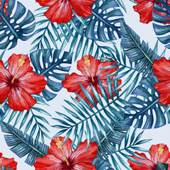 Watercolor hibiscus flower and palm leaves seamless pattern.