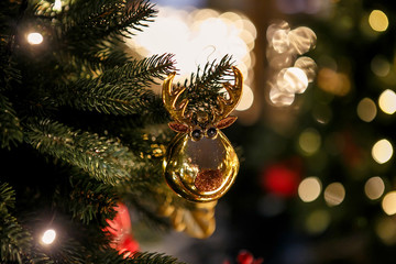  Christmas toys and light garlands on the Christmas tree - 317001350