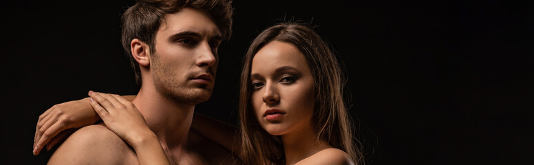 naked sexy young couple hugging isolated on black, panoramic shot
