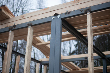 The construction of the store is made of metal and wood. Creating designs for trade. Designing a small house. Metal profile clutch.