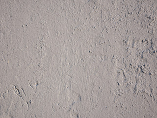 Gray stucco texture on concrete wall. Beautiful gray textured stucco on the wall.