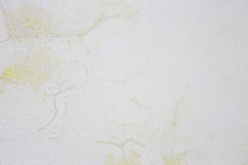Gray abstract texture from old cracked stucco. Wall with old damaged gray paint.