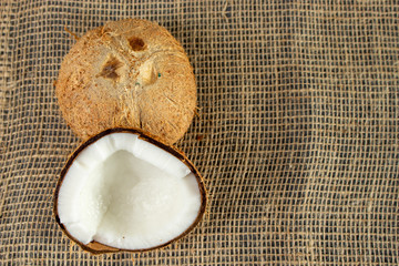 Dried coconut, broke in half. with copy space.