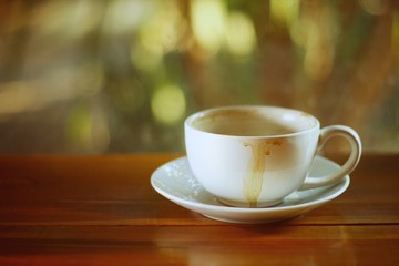 cup of coffee on wooden table