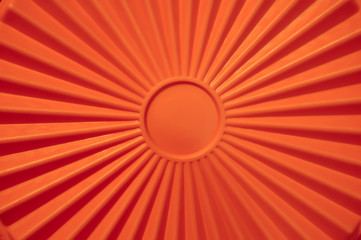Geometric sun with sunbeams. Orange wallpaper.
