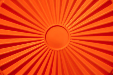 Geometric sun with sunbeams. Orange wallpaper.