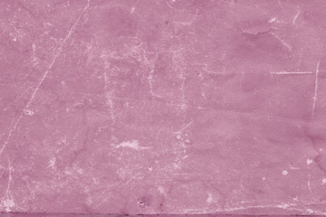 Fototapeta premium Cardboard pink abstract pattern texture close-up. Retro old paper background. Grunge concrete wall. Vintage blank wallpaper.