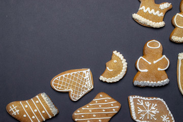 Christmas background. Handmade festive gingerbread cookies. Copy space for text. Winter holidays background mock up
