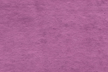 Cardboard pink abstract pattern texture close-up. Retro old paper background. Grunge concrete wall. Vintage blank wallpaper.