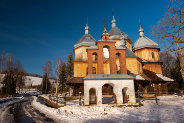 Wooden Orthodox Church in Bystre. Carpathian Mountains and Bieszczady Architecture in Winter