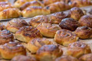Roll cinnamon in a glaze of sugar syrup, baked, golden, and delicious.