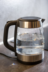  Electric kettle boils in the kitchen