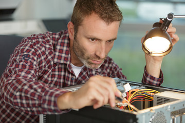 male electrician checking the cables