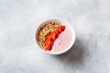 Homemade yogurt with fresh strawberries and muesli. The concept of a healthy Breakfast. Copy space.