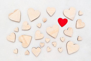 Valentines Day background with wooden hearts on a concrete background, top view. Valentines Day concept