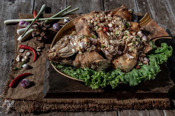 Deep fried whole Tubtim fish with spicy lemongrass salad, Food for health.