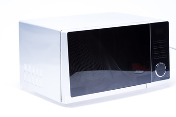 metal and electrical microwave oven on white background