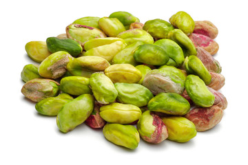 Heap of peeled pistachio nuts isolated