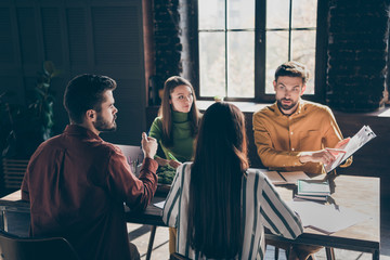 Skilled smart businesspeople ceo boss chief director company owner wearing casual formal-wear attending conference discussing IT progress at modern industrial loft style interior work place station