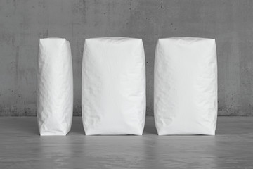 White sacks on the concrete floor. 3d render