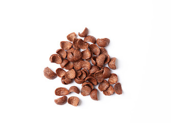 Chocolate cereal flakes on white background. Crispy chocolate crunch corn flakes. 