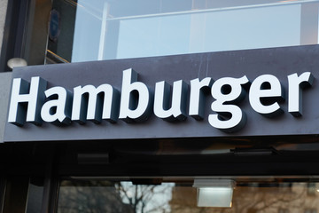 sign of street food hamburger text wall restaurant building on black background