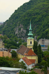 Fototapeta premium Yellow castle near a mountain