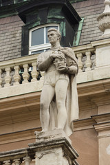 statue of man with head in hands