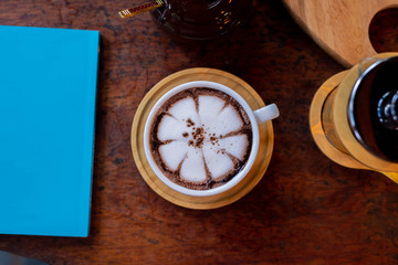 top view latte art and blue book on table,latte art coffee, latte art, background